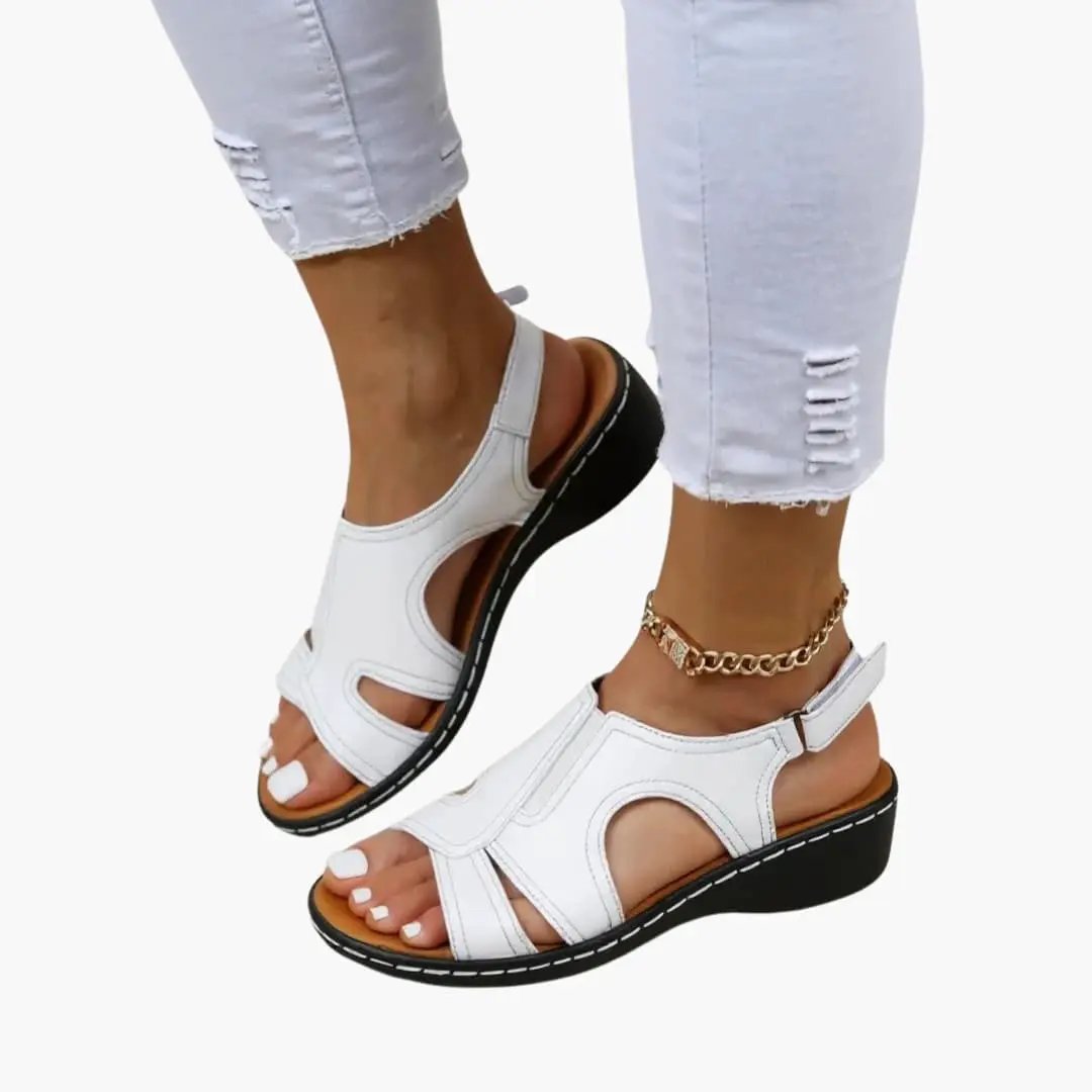 Women's white sandals with cushioned insole and adjustable fastening; open-toe straps, black sole.