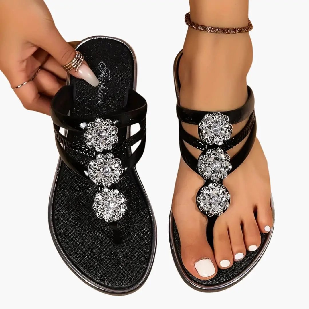 Pair of Wilfred Smith women's sandals with embellished crystal straps, open toe, cushioned insole, black.