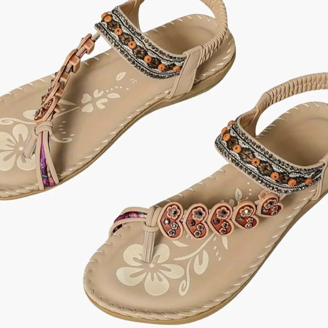 Wilfred Smith women's sandals, beige open-toe slip-ons with floral bead straps; pair shown