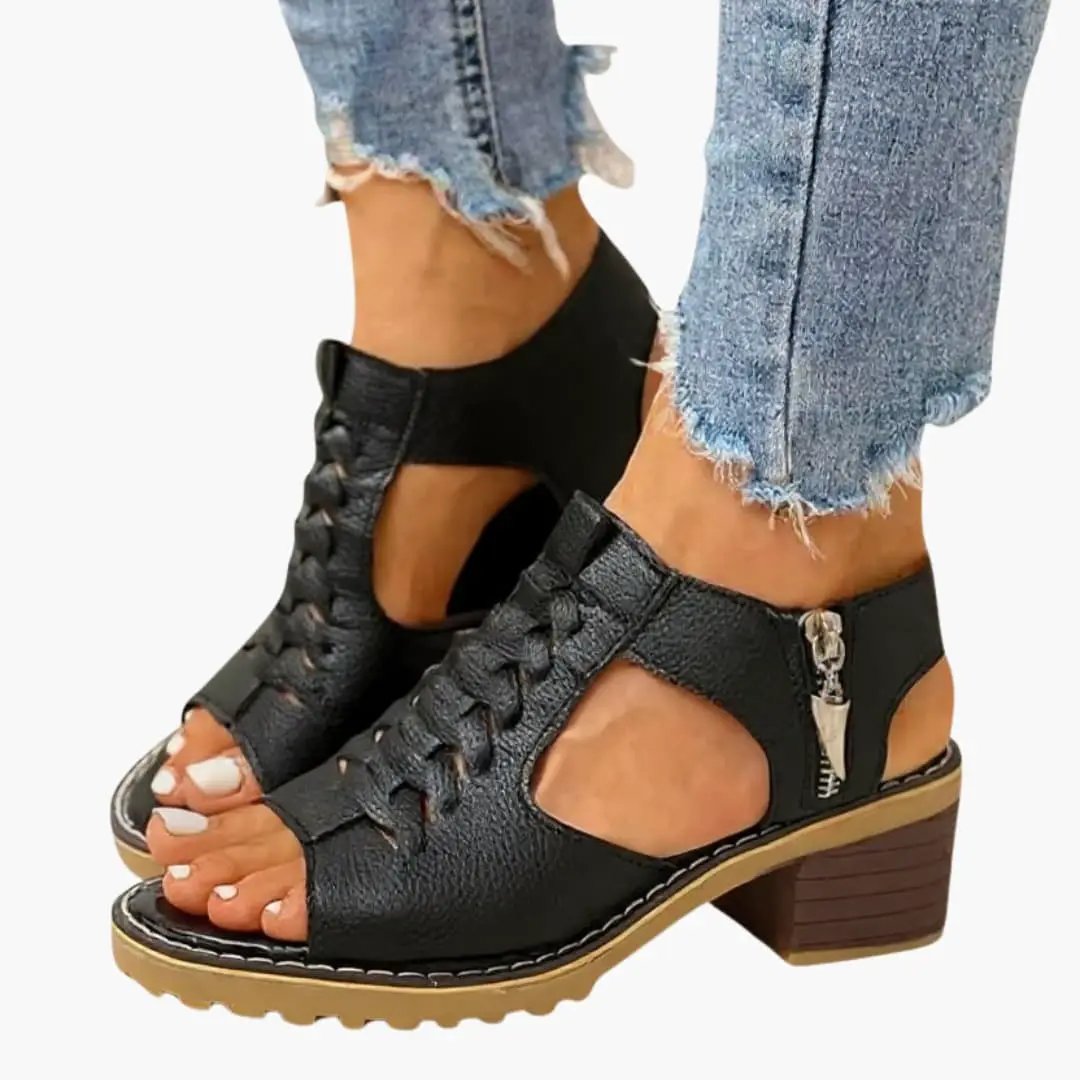 Black leather women's sandals with side zip closure, cutout sides, lace-up front, chunky block heel and tan sole