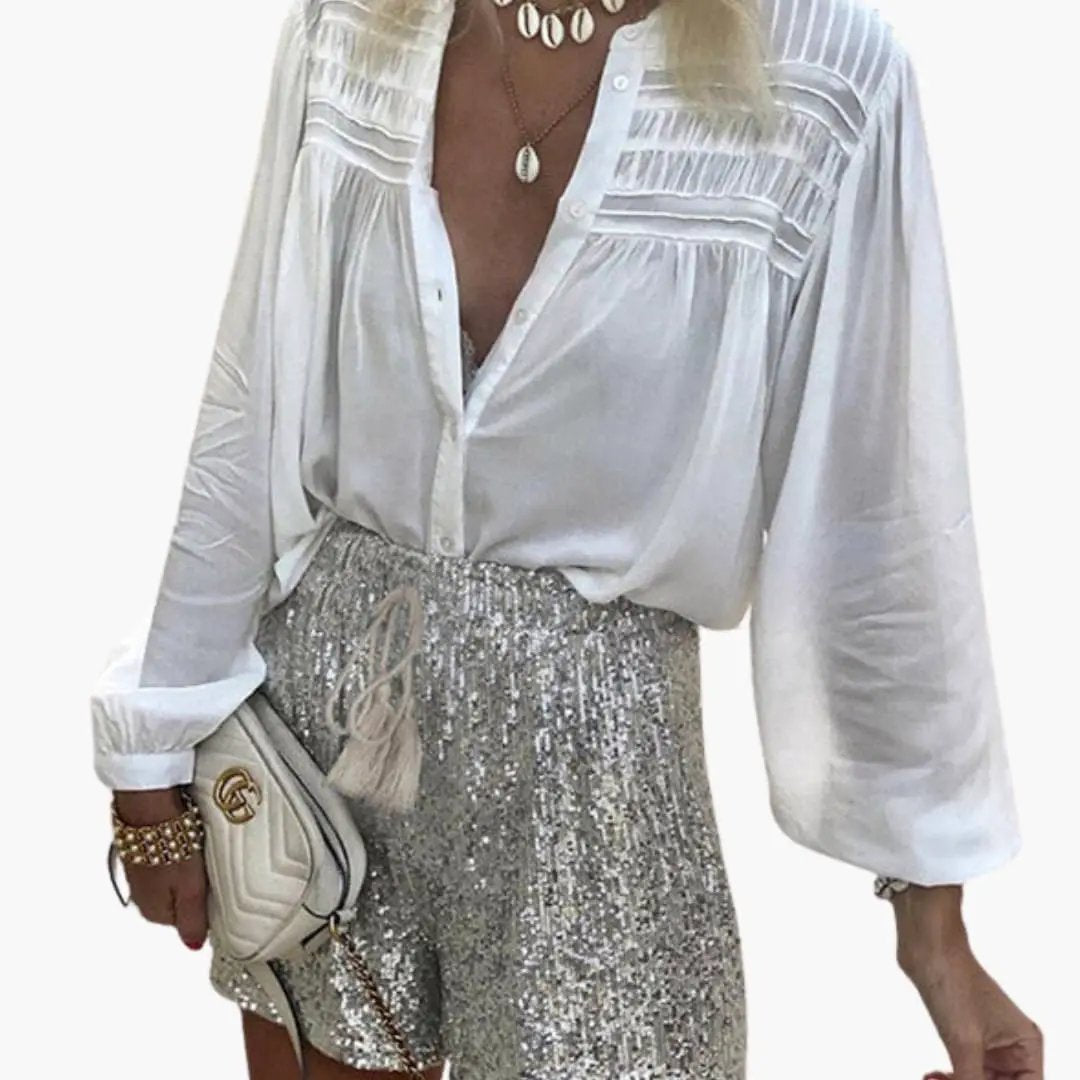 Women's sequin shorts with elastic waist and drawstring; silver metallic sequins catch light for evening party wear.