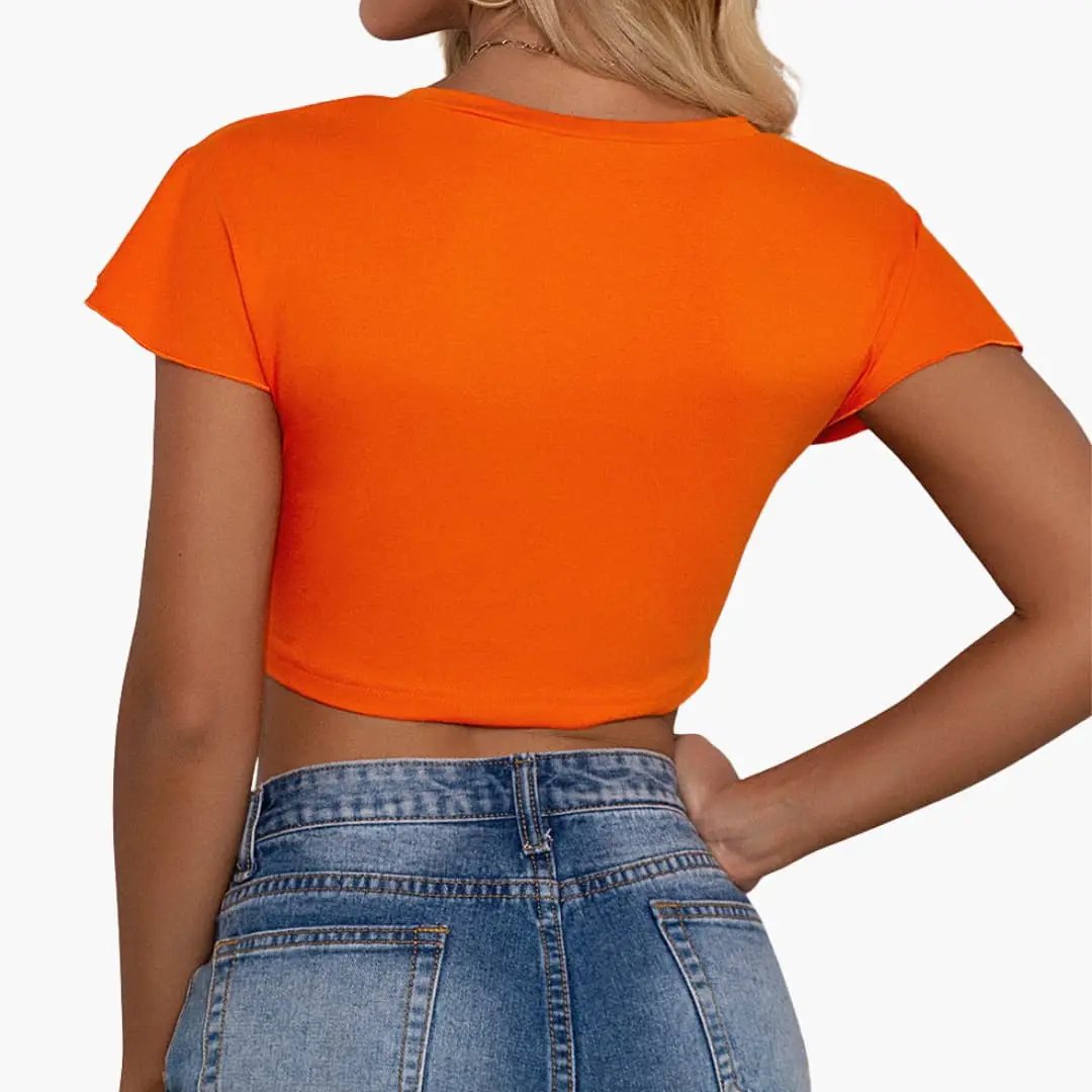 Women's orange crop top with short sleeves, back view of knot-front style