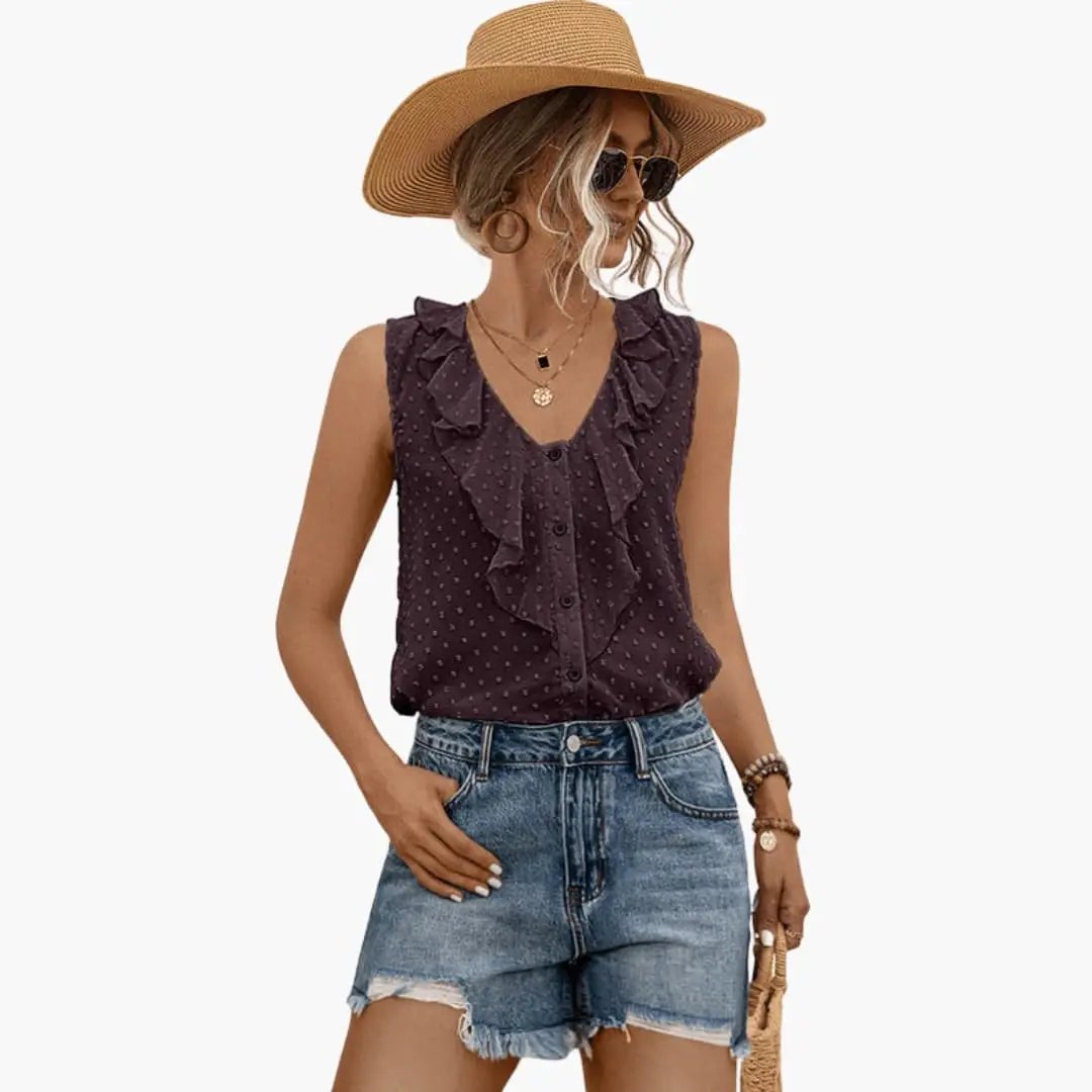 Women's sleeveless V-neck blouse with ruffle trim in dark purple polka-dot pattern