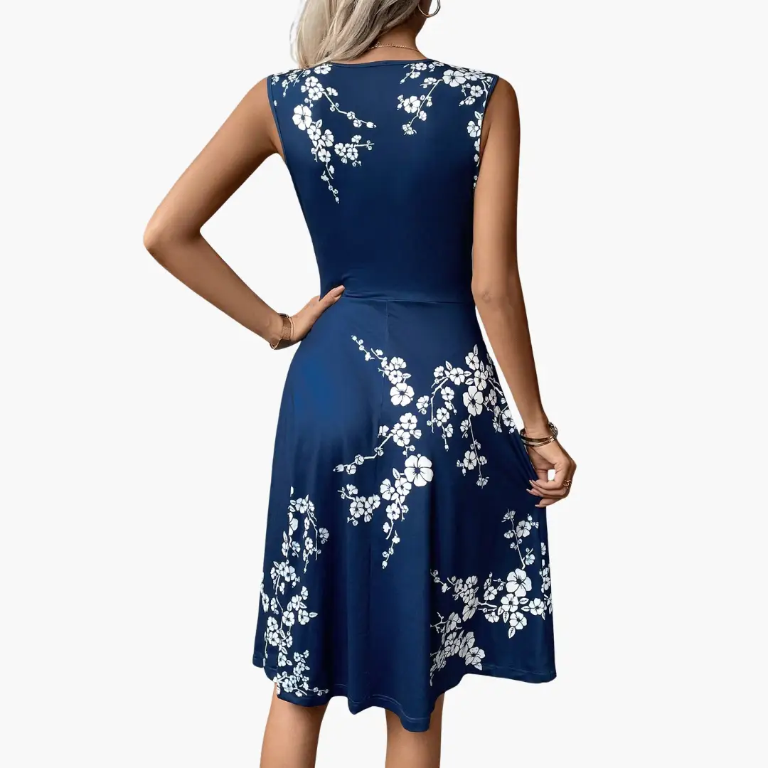 Women's sleeveless V-neck floral midi dress in navy blue with white blossoms.