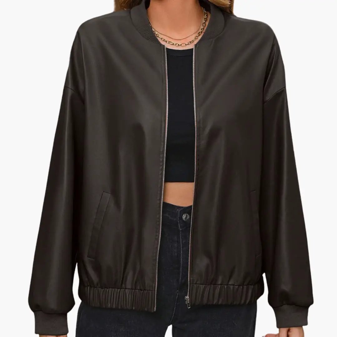Women's bomber jacket by Wilfred Smith in dark brown with elastic cuffs, front zipper, and pockets.