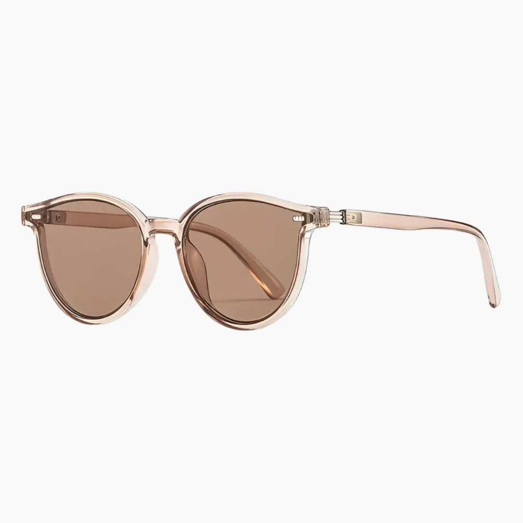 Women's sunglasses with lightweight rose gold translucent full rim frame and brown UV lenses by Wilfred Smith