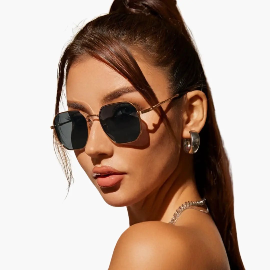 Women's sunglasses with a gold-tone metal frame by Wilfred Smith, UV400 dark lenses.