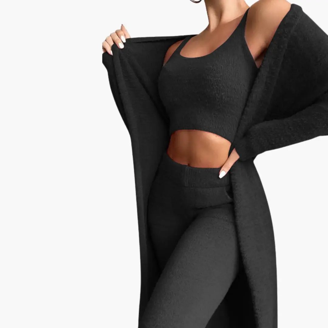 Women’s three-piece outfit by Wilfred Smith in black knit with cardigan, crop top, and leggings.
