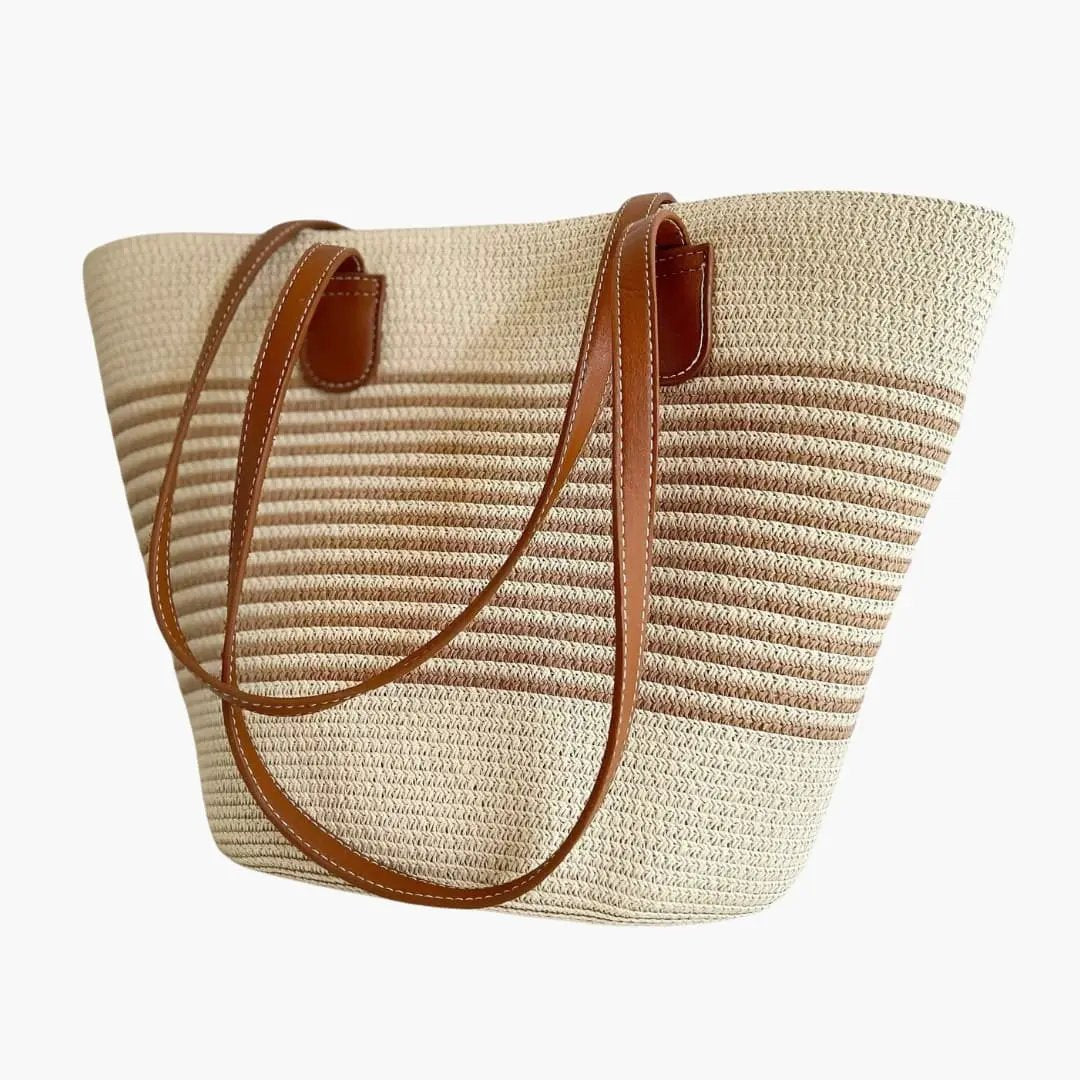 Women's tote bag by Wilfred Smith, woven straw with brown leather shoulder straps.