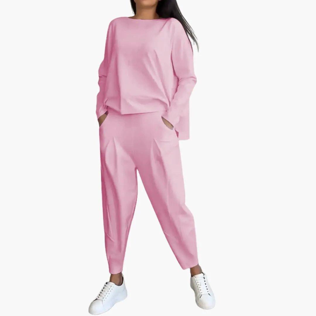 Women's two-piece outfit by Wilfred Smith in pink with round-neck top and pocketed trousers