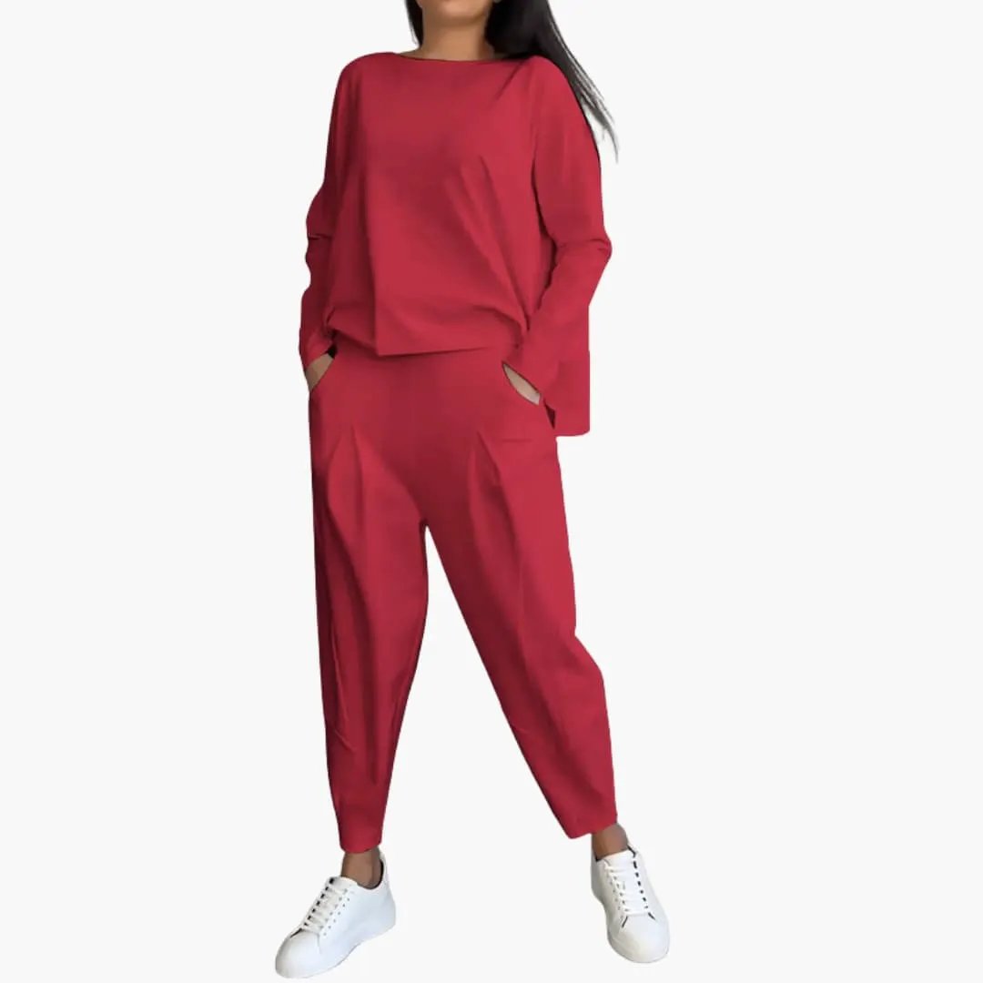 Women's two-piece red outfit with round-neck top and matching tapered trousers