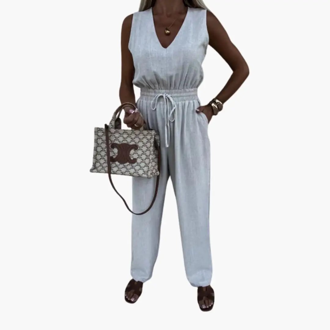 Women's V-Neck Jumpsuit with Tie Waist in light blue linen; sleeveless one-piece with drawstring waist.