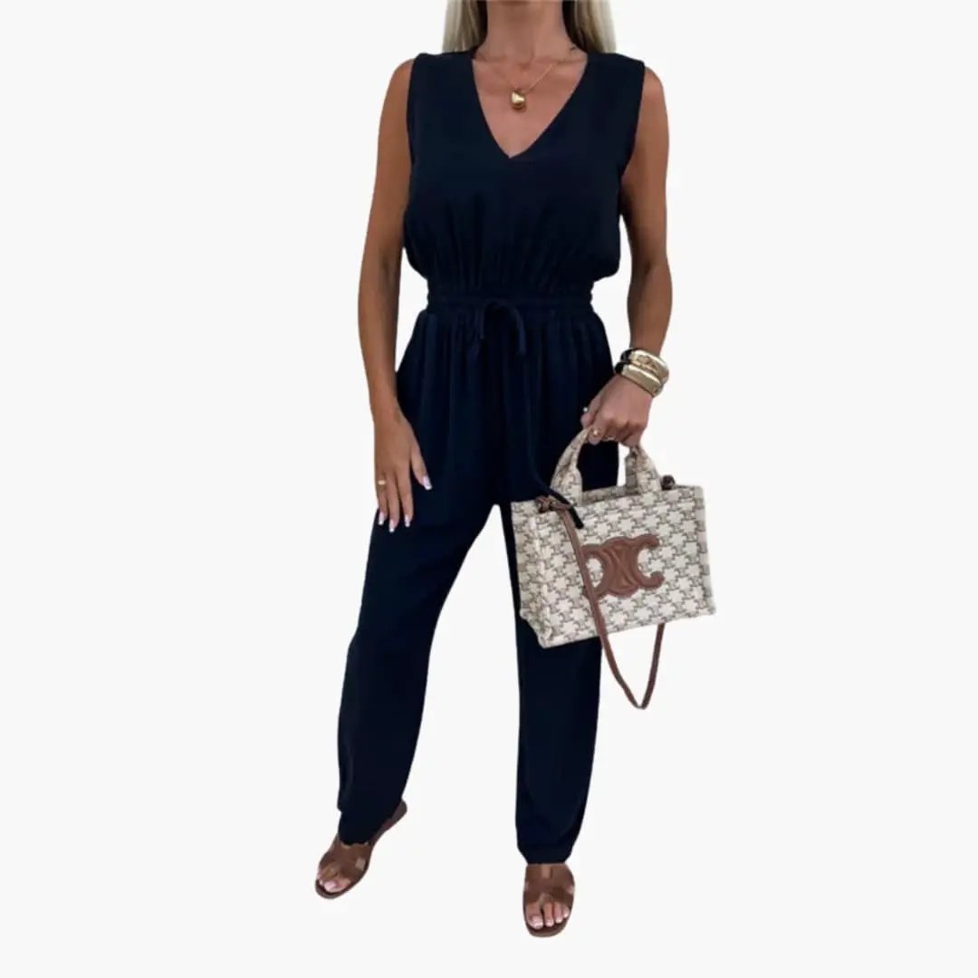 Women’s V-Neck Jumpsuit with Tie Waist, navy; 2-piece set includes beige patterned handbag