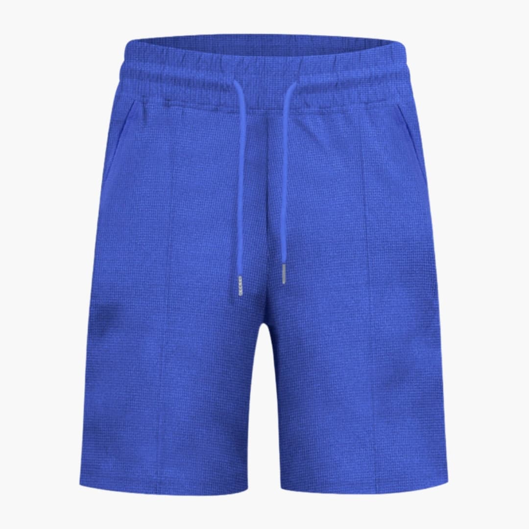 Women's blue waffle-textured shorts with elastic waistband and drawstring, straight-leg.