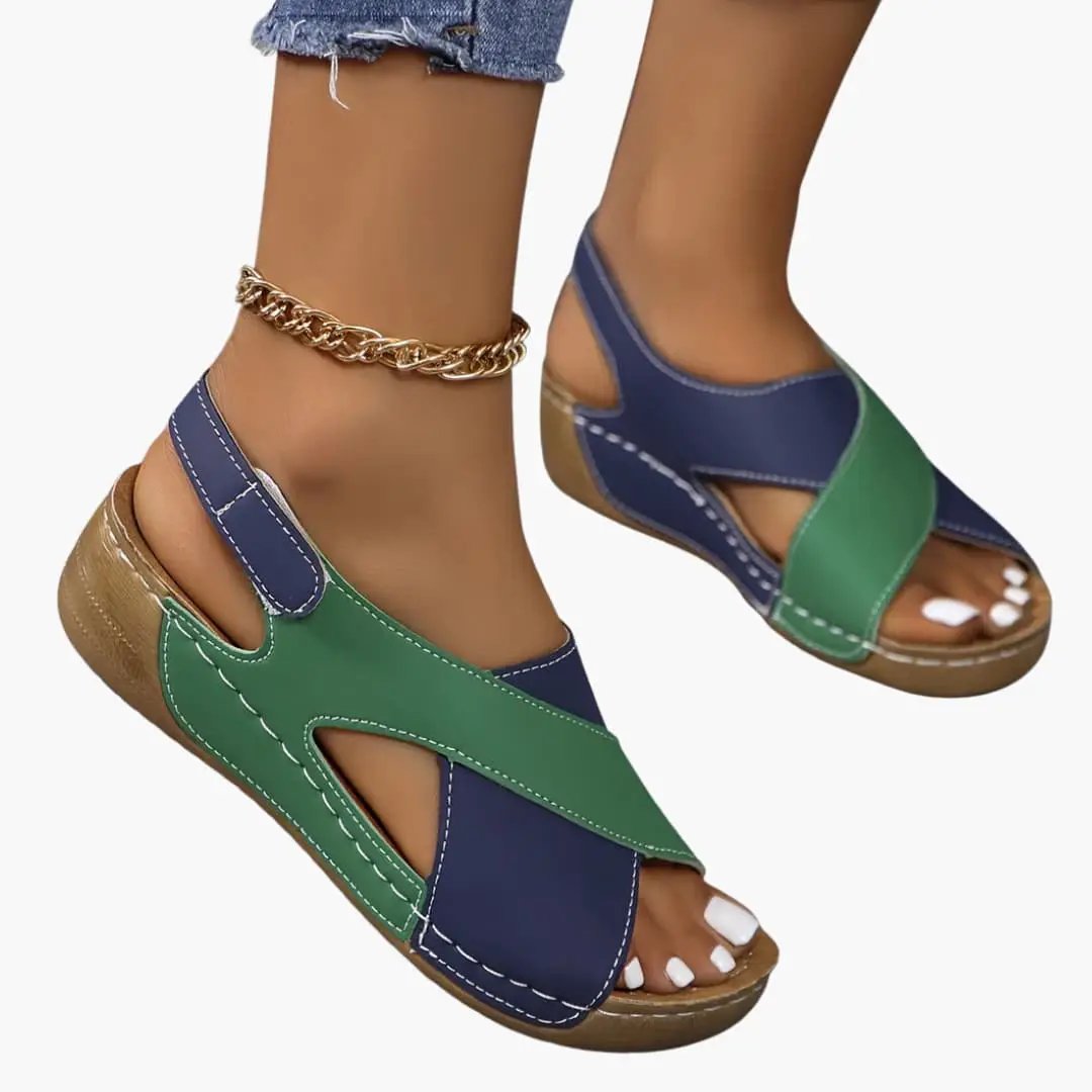 Women's walking sandals with adjustable navy and green straps, cushioned insole, open-toe