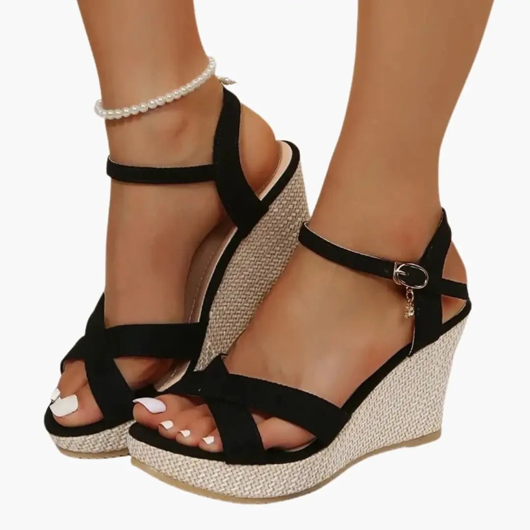 Wilfred Smith women's wedge sandals pair with black cross straps, ankle buckle, cushioned insole, natural jute platform
