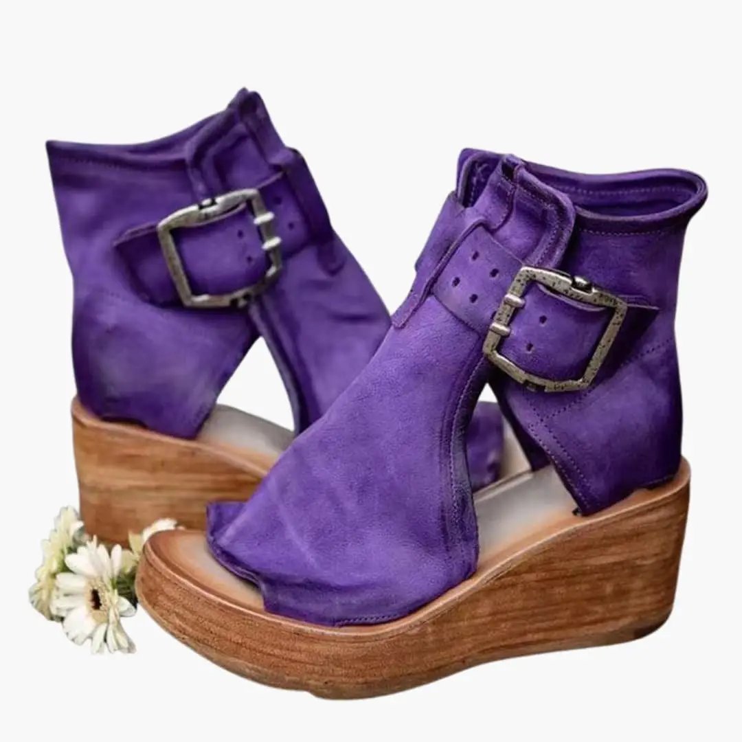 Wilfred Smith women's wedge sandals with buckles in purple and a contoured wooden wedge sole.