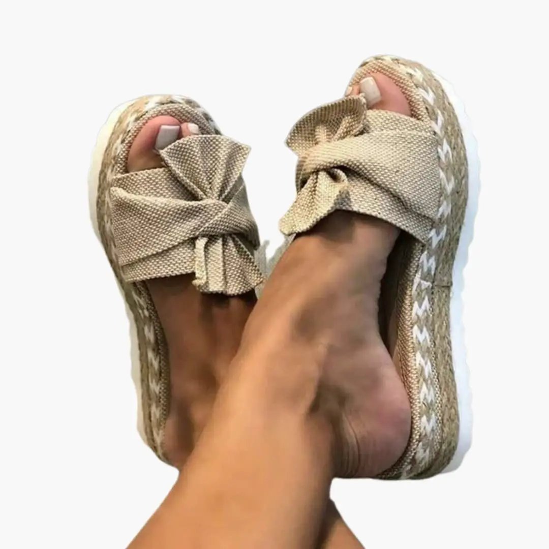 Wilfred Smith women's wedge sandals with woven upper and bow detail in beige