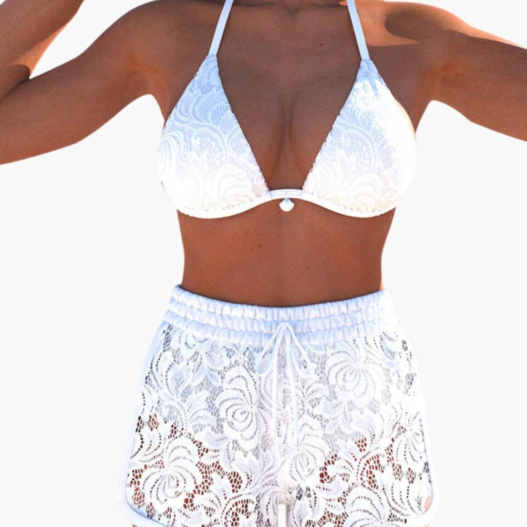 Women’s white lace strapless bikini top with matching lace shorts by Wilfred Smith