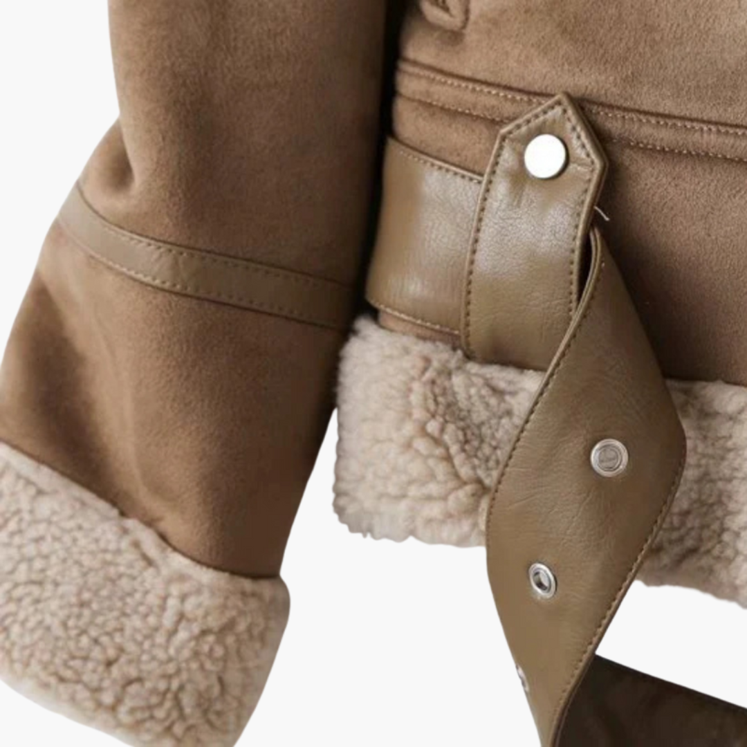 Women's zip jacket with plush inner layer and adjustable belt hem.